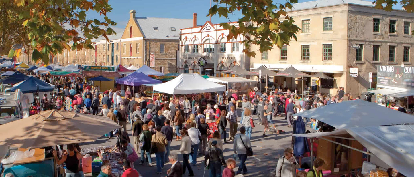 Crowds of people explore Salamanca Market in Hobart, Tasmania